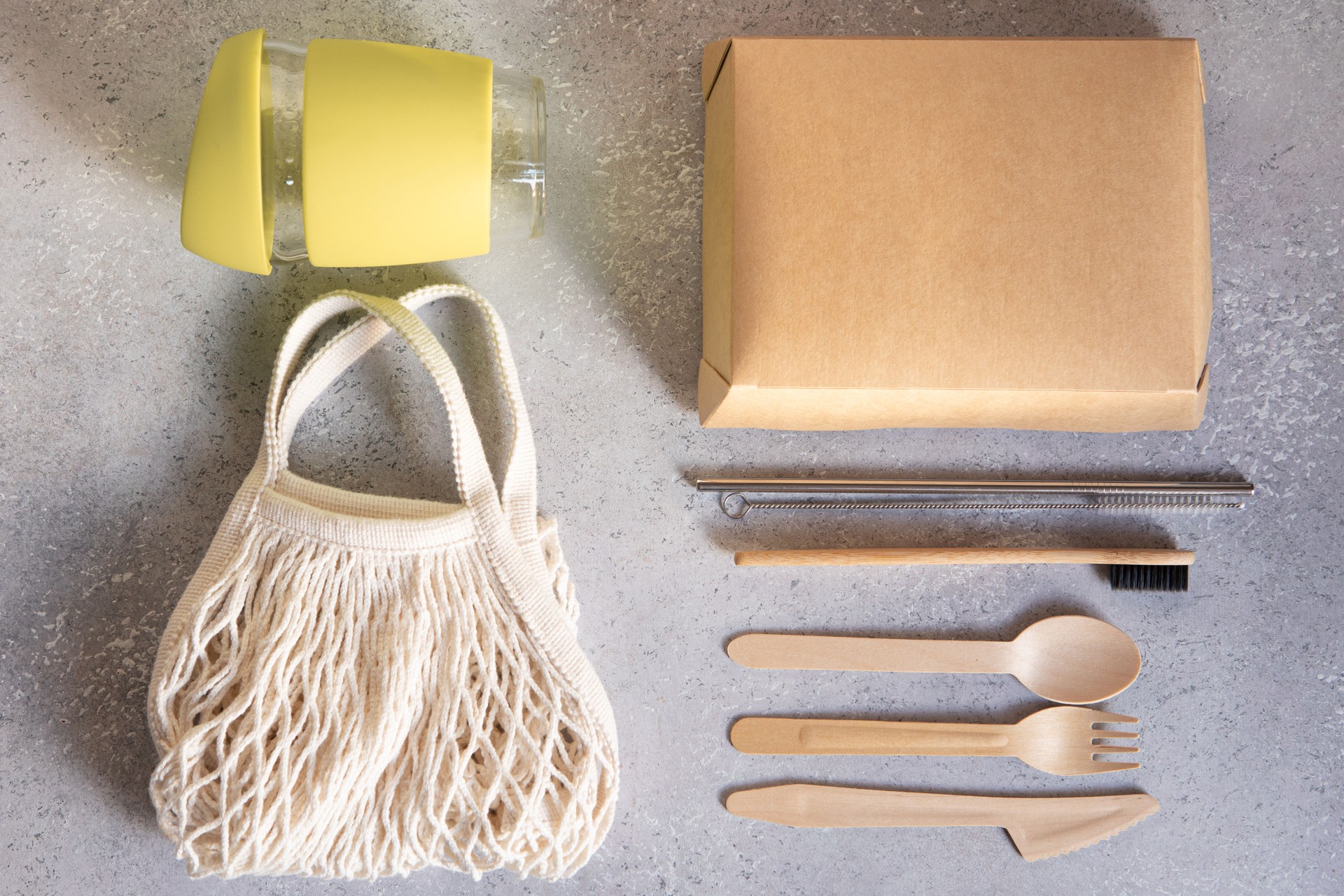 Natural color eco bag with reusable coffee mug. Zero waste concept. Plastic free. Flat lay, top view